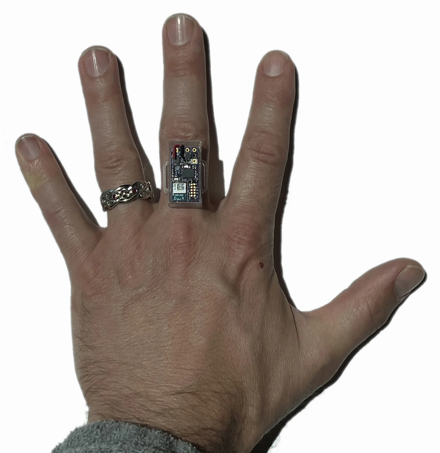 Figure 2: Posey ring placed on a finger for a sense of scale.